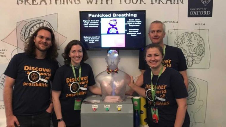Four researchers and a brain/lungs model at Royal Society Summer Science Exhibition