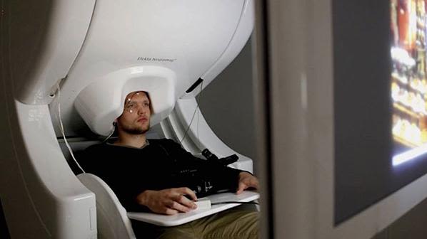 Young man in magnetoencephalography scanner